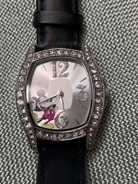 Mickey Mouse watch with crystal surround and black leather band.